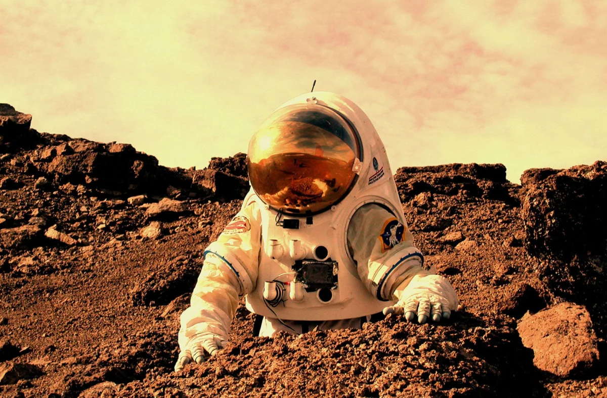 Engineering the Future of Extravehicular Activity: The Critical Challenge of Reducing Spacesuit Mass for Human Mars Exploration